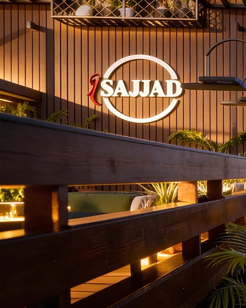 SAJJAD Restaurant wooden sign wall with ambient glow